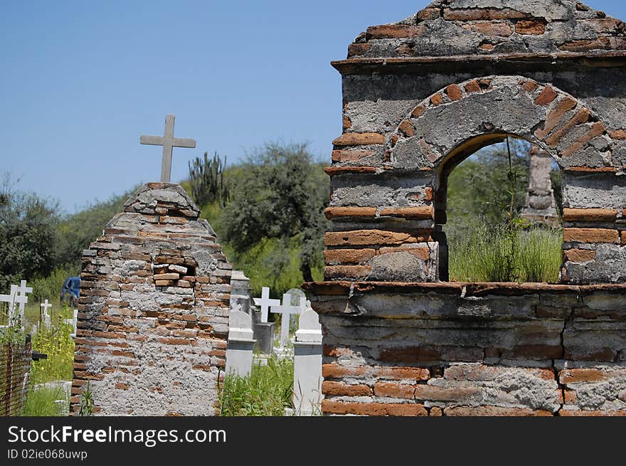 Couple of old brick tombs in a green cementery. Couple of old brick tombs in a green cementery