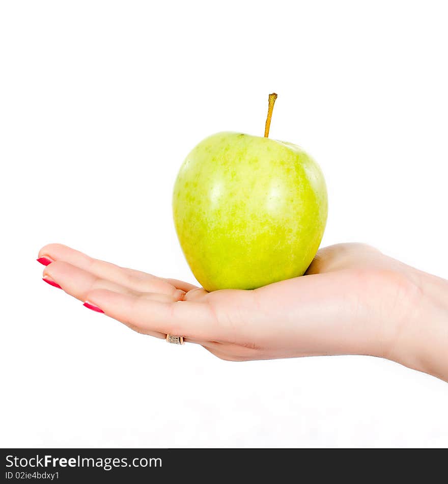 A hand holding a green apple isolated on white background. A hand holding a green apple isolated on white background