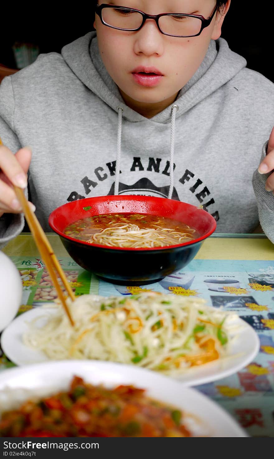 Chinese girl eating Noodles