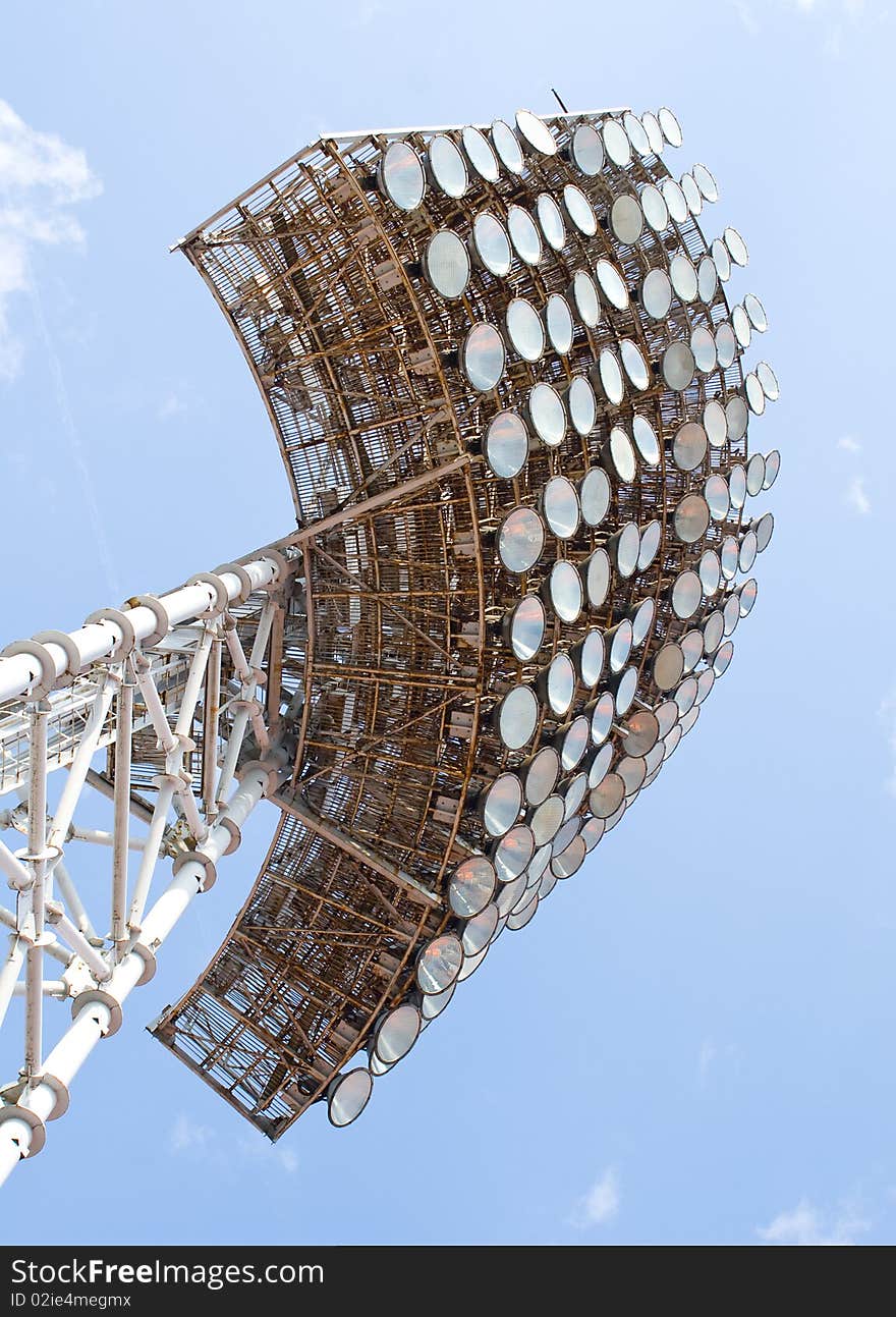 Stadium light tower against a blue sky