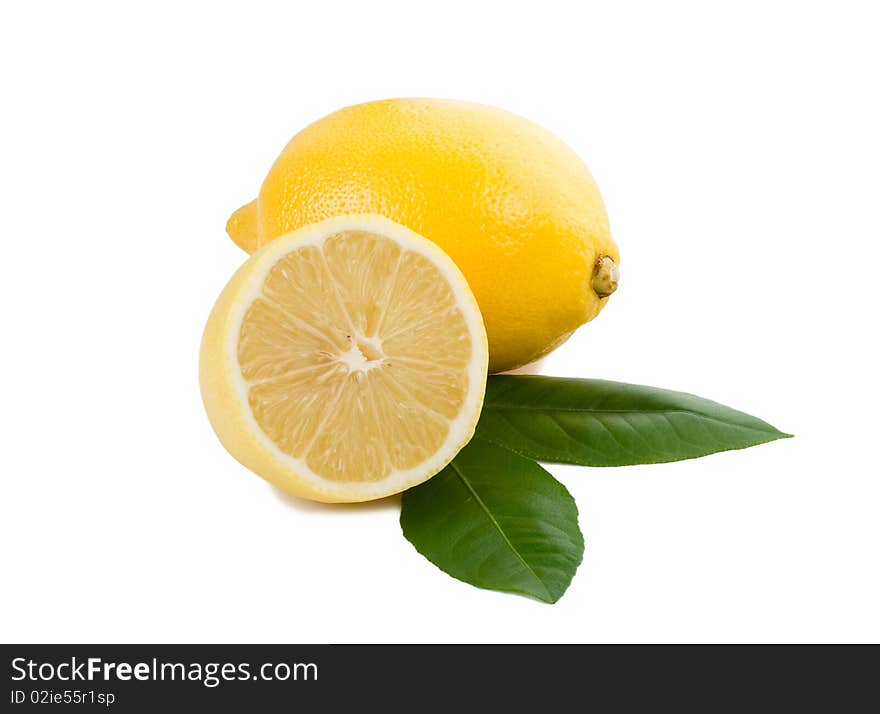 Close-up lemon full and half with leaves, isolated on white