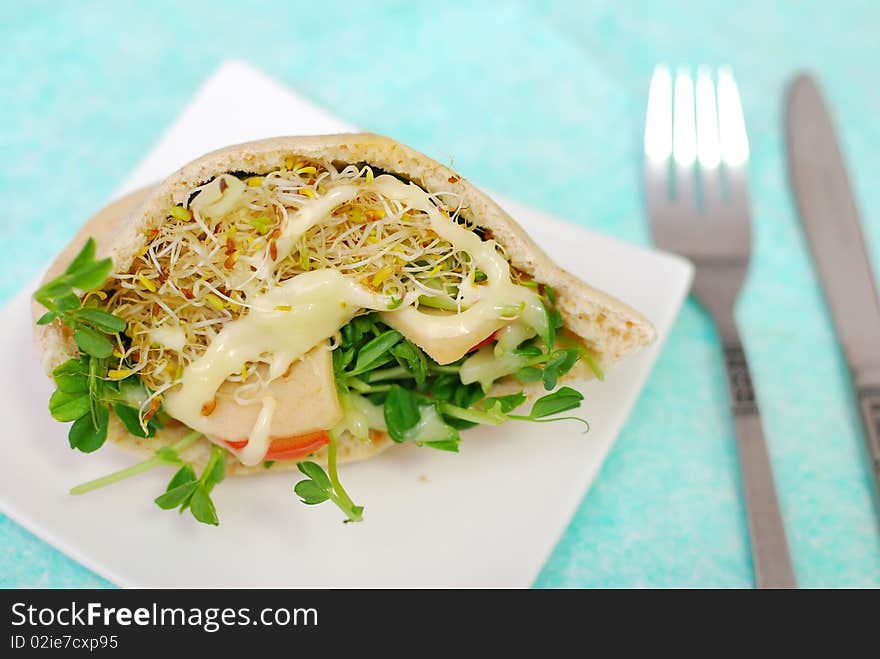 Top view of salad sandwich filled with fresh salad. Healthy eating, diet and nutrition, and lifestyle concepts.