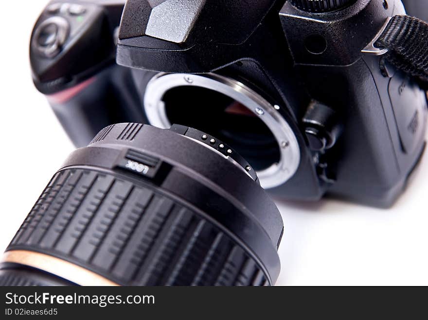 Modern digital camera equipped with zoom lens isolated on white