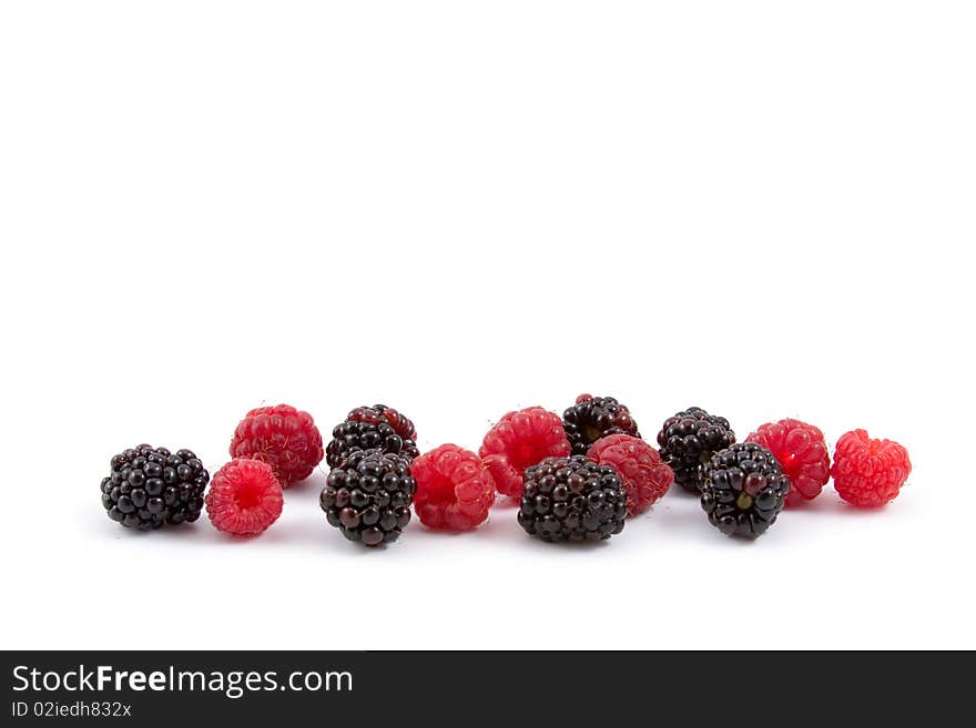 Berries: raspberries and blackberries isolated on a white background