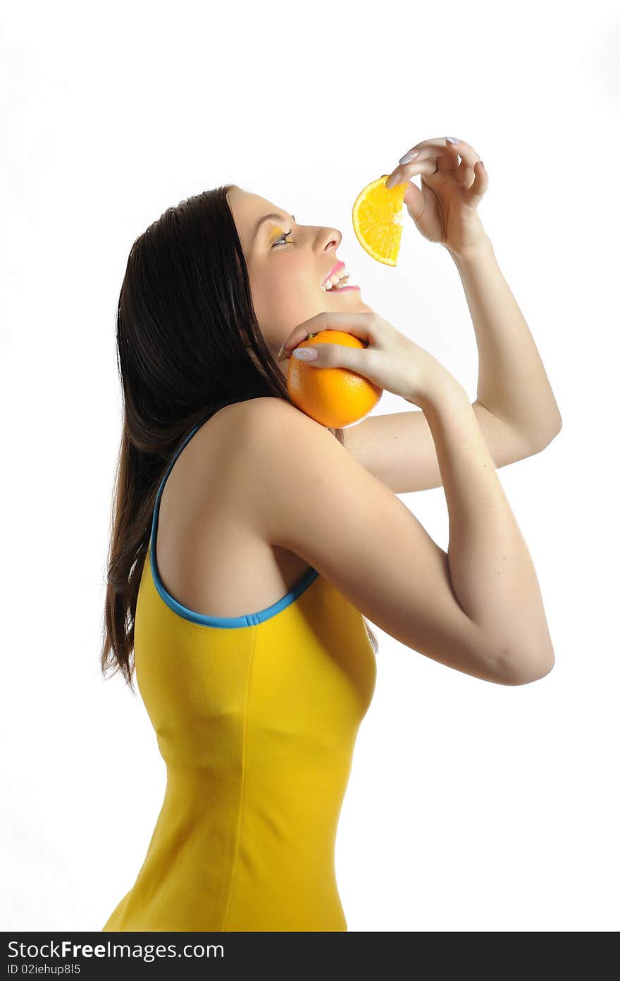 Portrait of a young healthy beautiful smiling woman with a half of citrus fruit orange . AHA-oxids. Portrait of a young healthy beautiful smiling woman with a half of citrus fruit orange . AHA-oxids