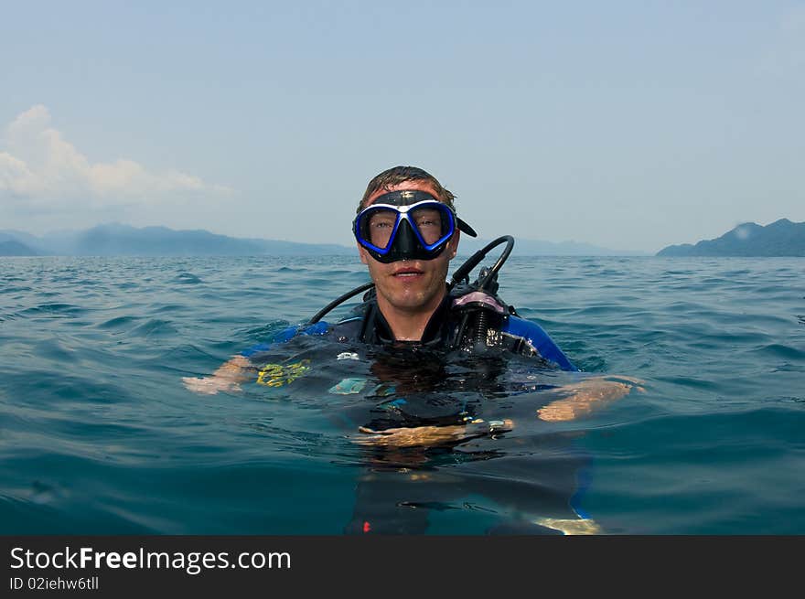 Scuba diver floating on surface. Scuba diver floating on surface