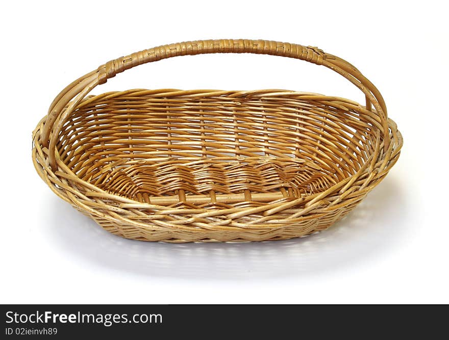 Small wicker basket over the white background