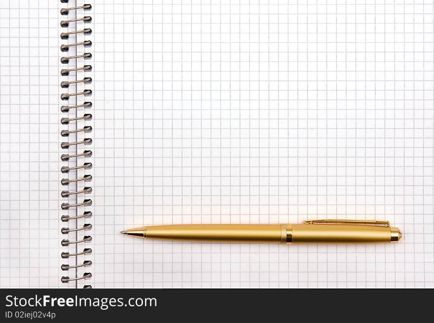 The image of the notepad and pen