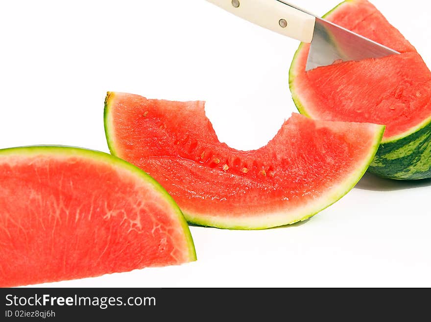 Cut slices of watermelon with knife