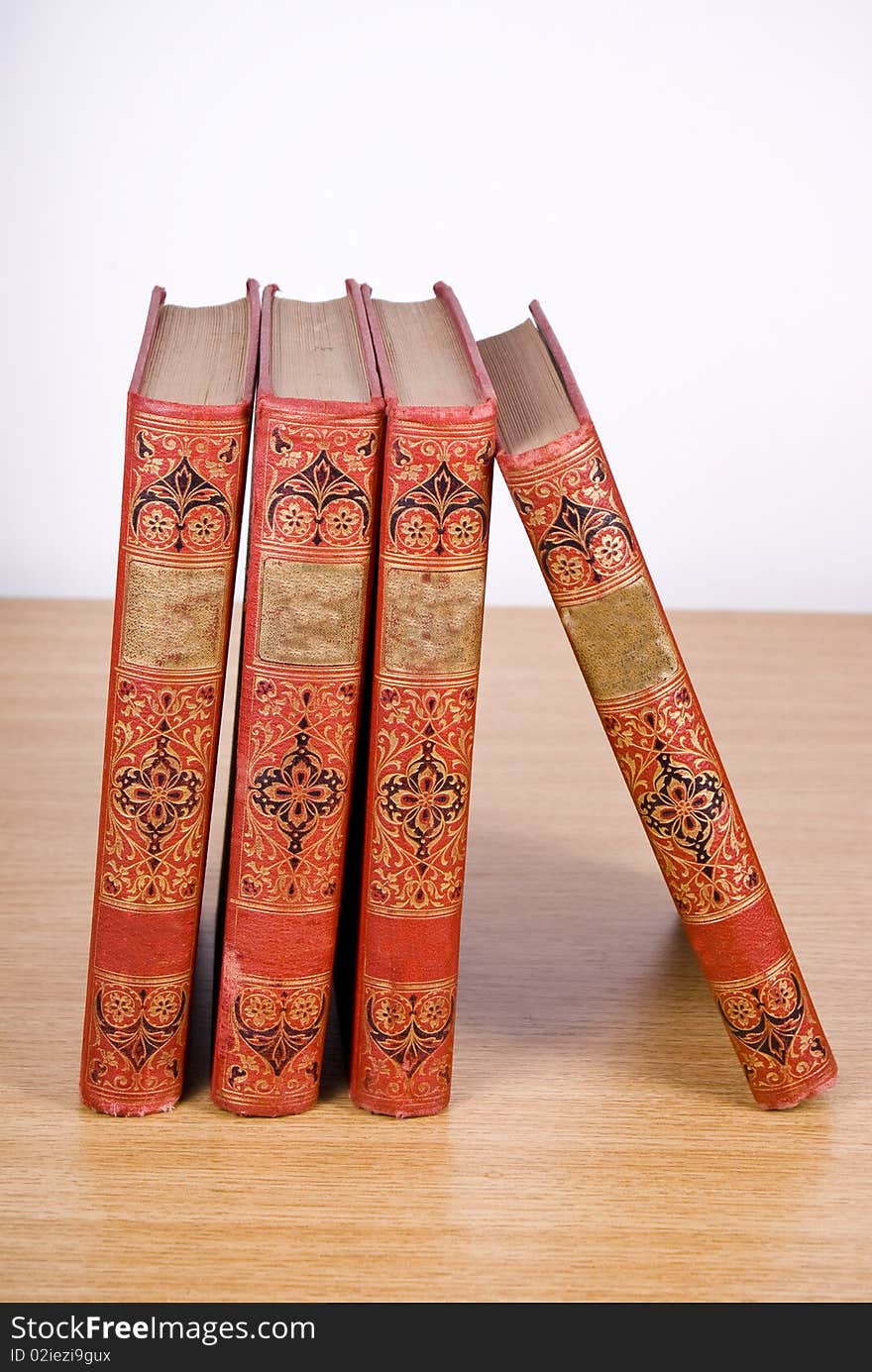 Old books placed on wood desk