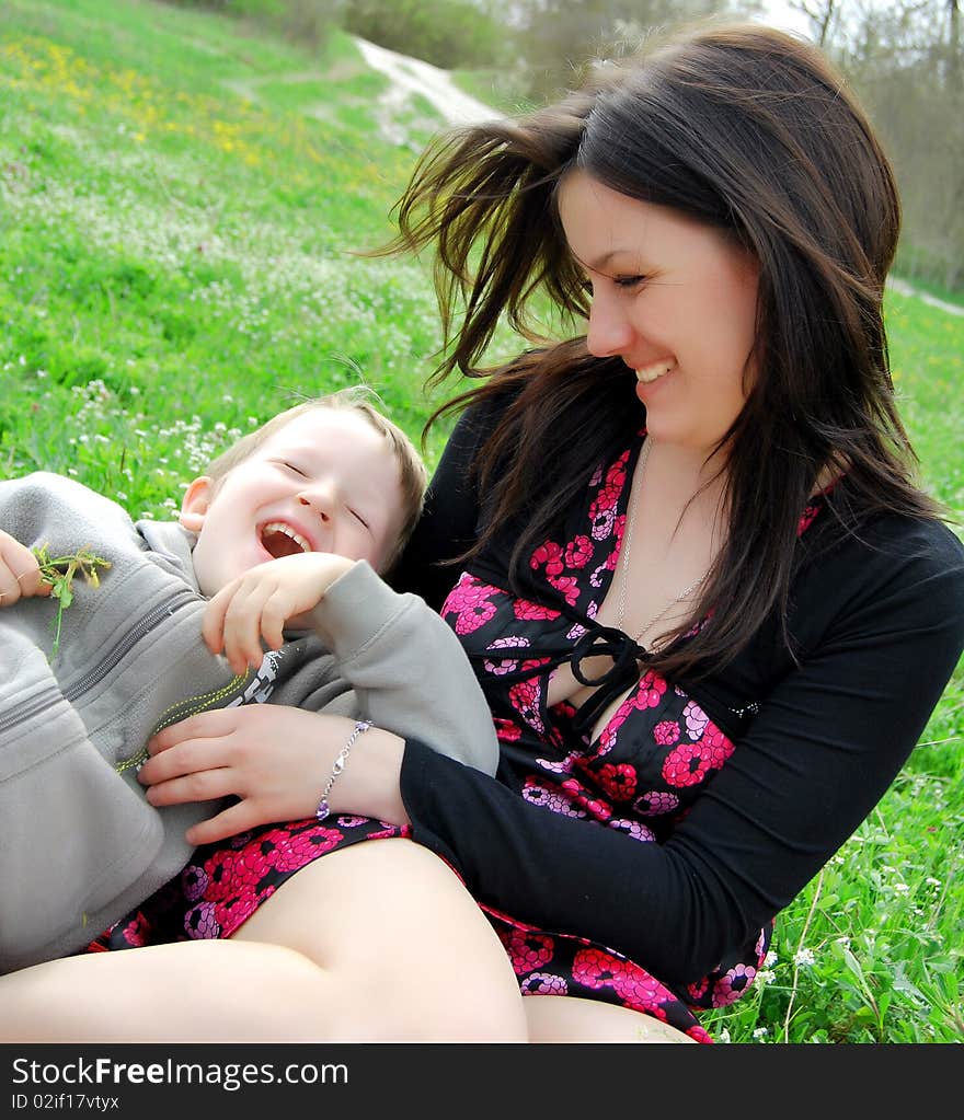 Mum and the son on a walk in the meadow