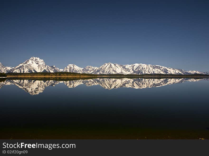 Reflection in the lac of the Grand Tetons in Wyoming