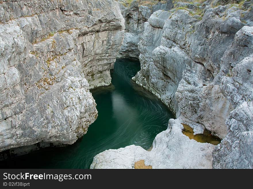 Green rive with rocks in wild nature