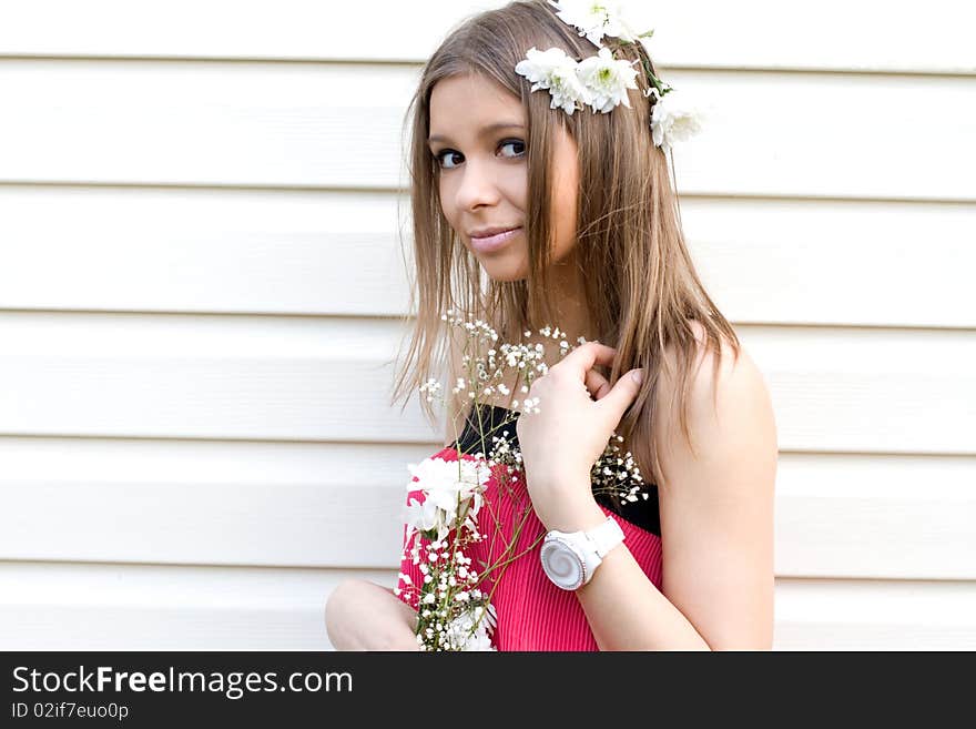 Girl with flowers posing outdoor