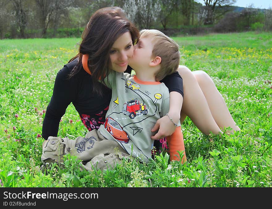 Mum and the son on a walk in the meadow