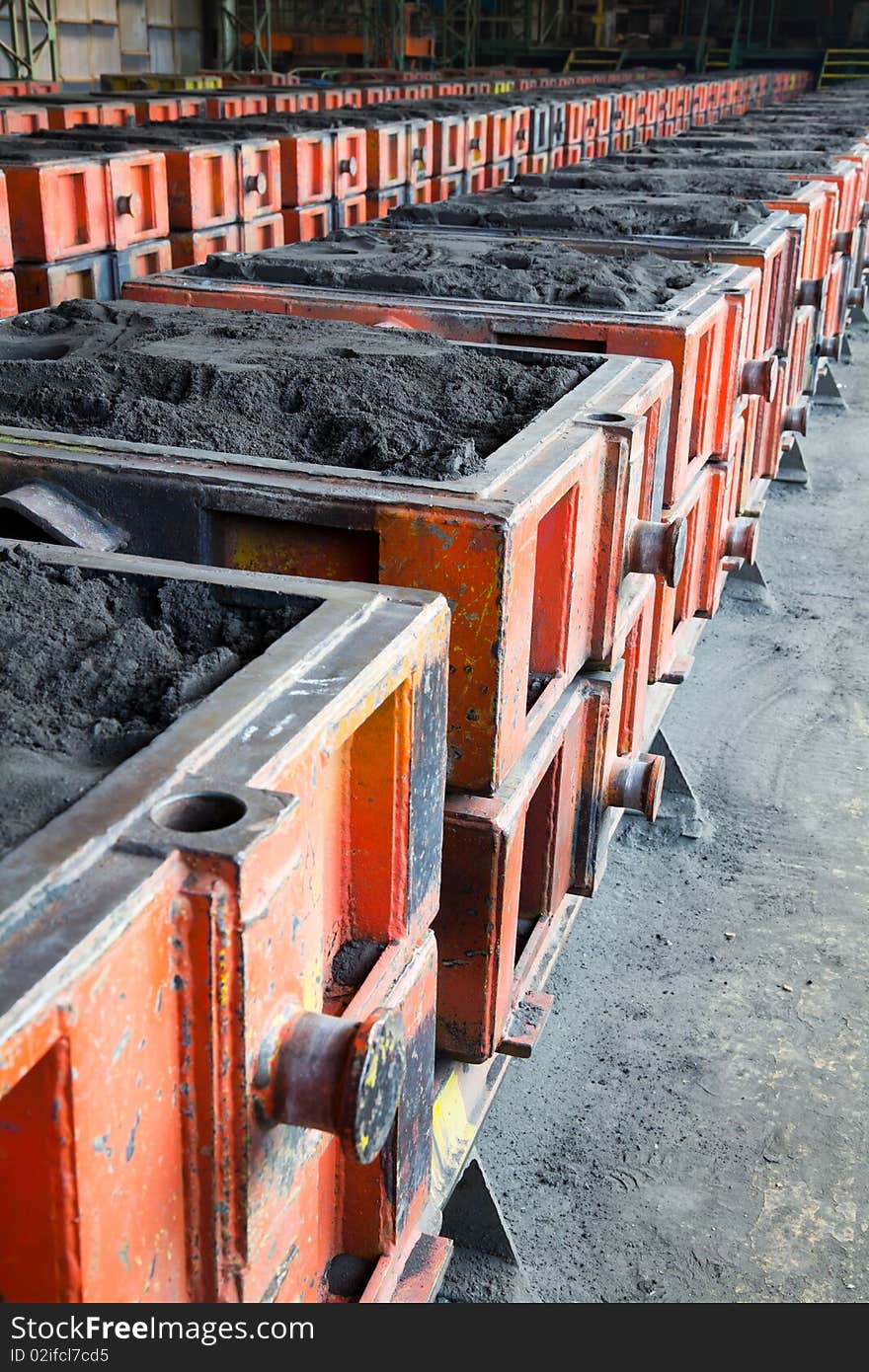 Row of carload with various materials in a factory. Row of carload with various materials in a factory