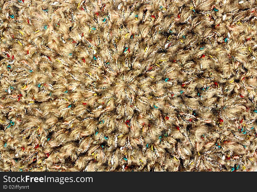 A background of a colorful knitted hat . A background of a colorful knitted hat .