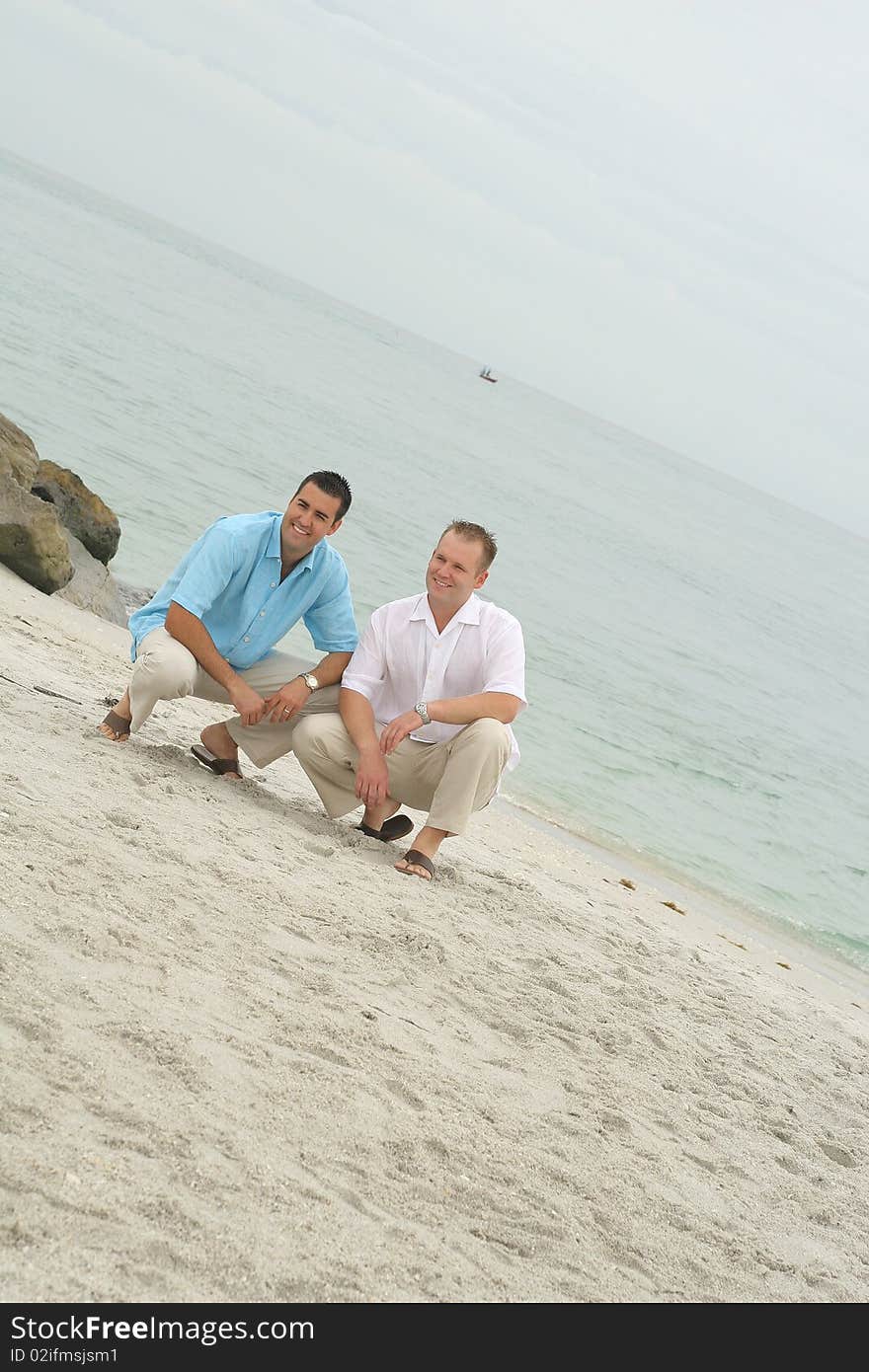 Handsome men on the beach