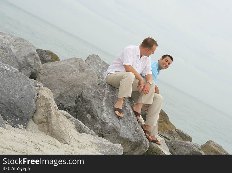 Attractive male models on rocks