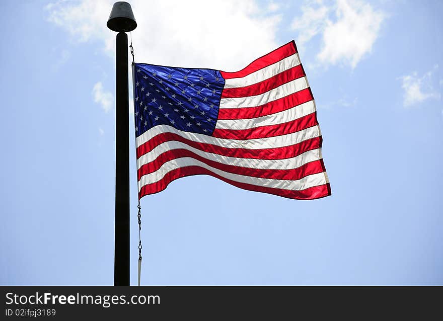 American flag with the blue sky in the background