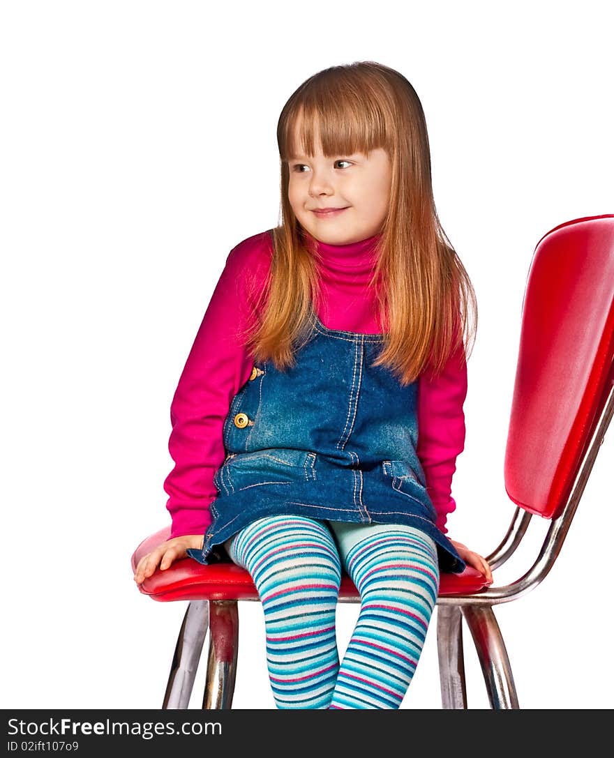 Portrait of beautiful little girl sitting on chair isolated on white