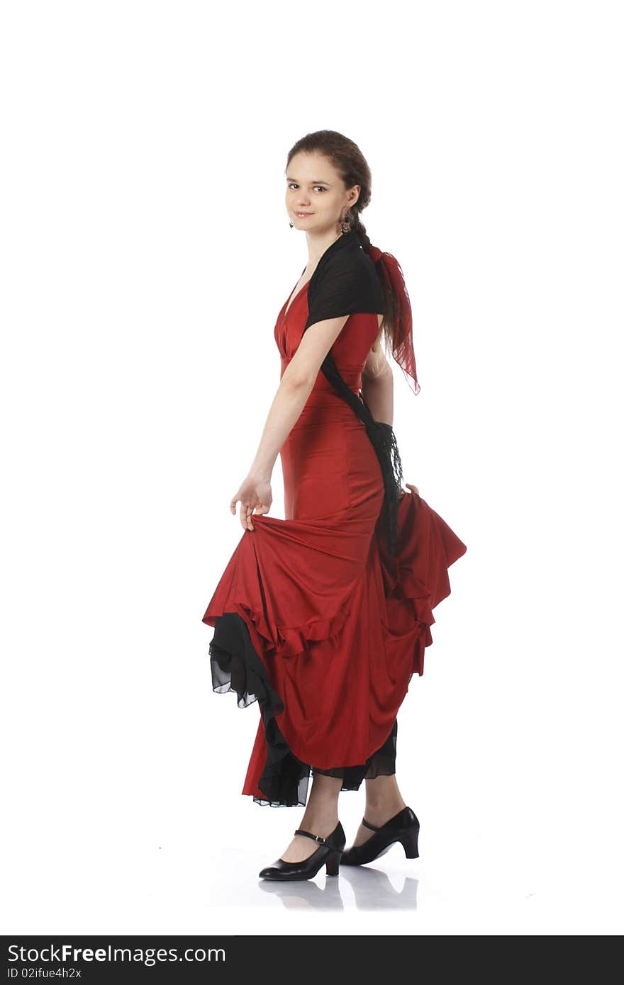 Young Spanish flamenco performer in a gorgeous red dress. isolated on white. Young Spanish flamenco performer in a gorgeous red dress. isolated on white