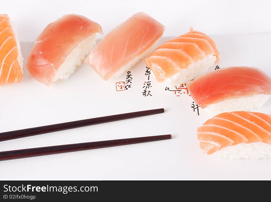 Salmon and tuna sushi with chopsticks