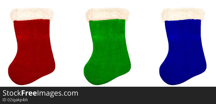 Three Christmas stockings over white.  Red, green, blue. Three Christmas stockings over white.  Red, green, blue.