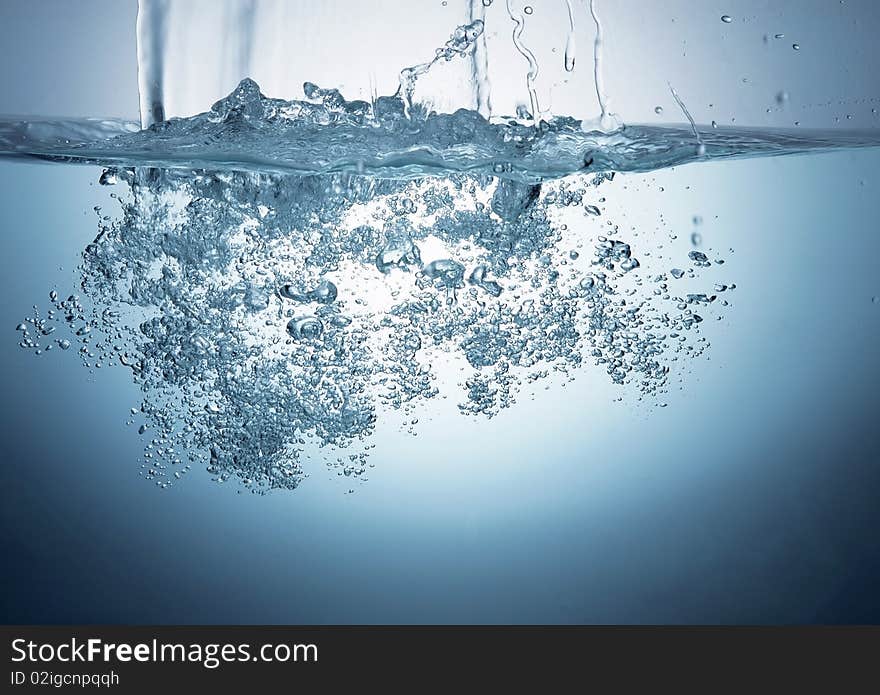 Wave and bubbles in a glass aquarium