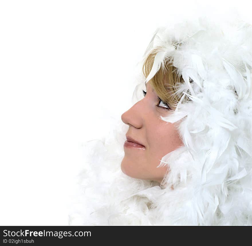 Profile Portrait of a girl with white feathers on white