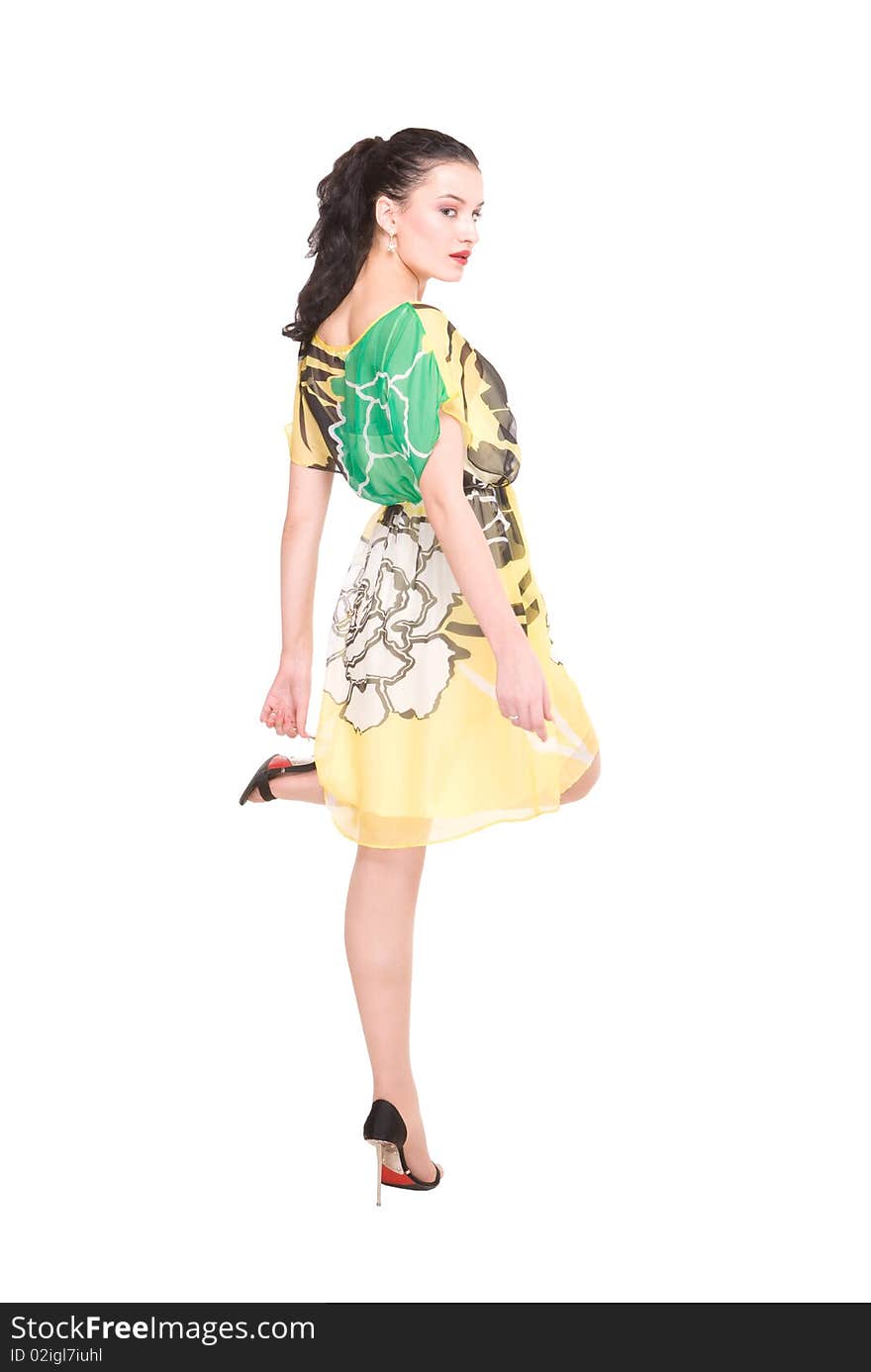 Beautiful young model in modern dress on white with clipping path