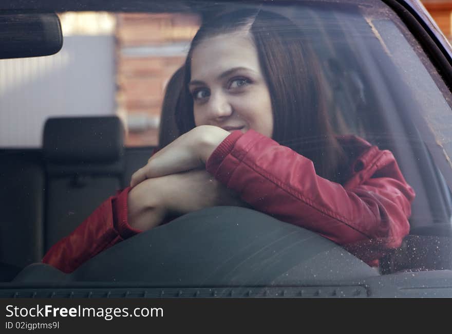 Color photography attractive young woman in automobile