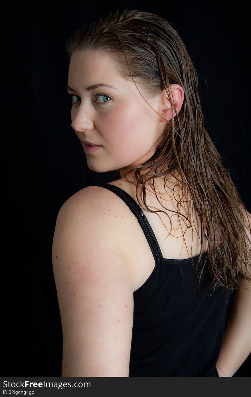 Pretty young lady with wet hair is posing. Pretty young lady with wet hair is posing