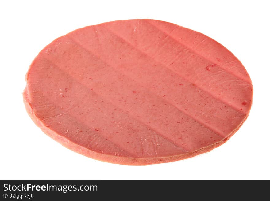 Round slice of sausage on a white background.