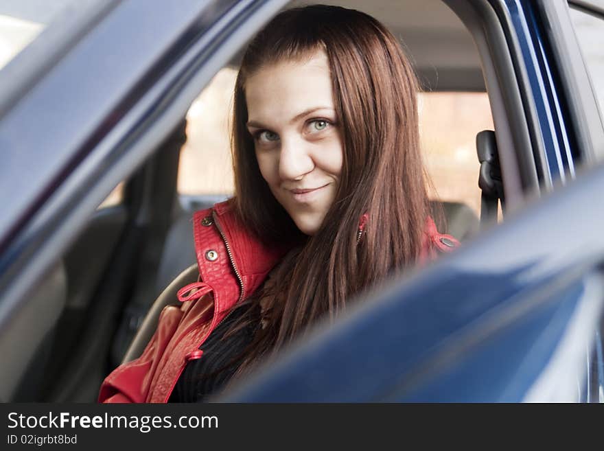 Attractive Young Woman In Automobile