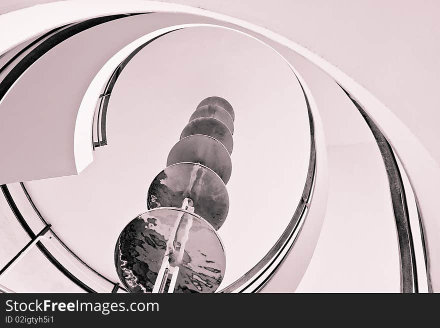 Spiral staircase with metal bar