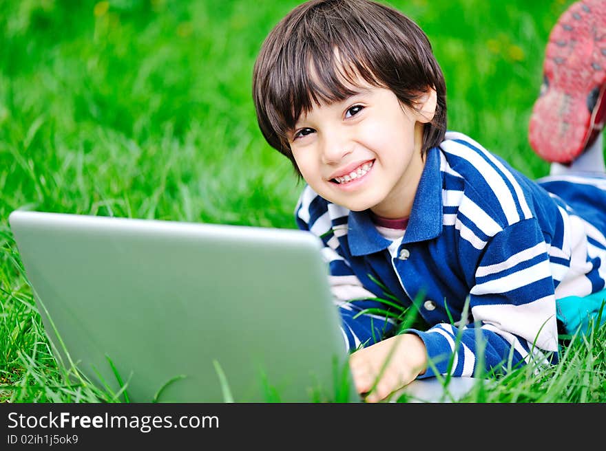 Children activity with laptop in nature