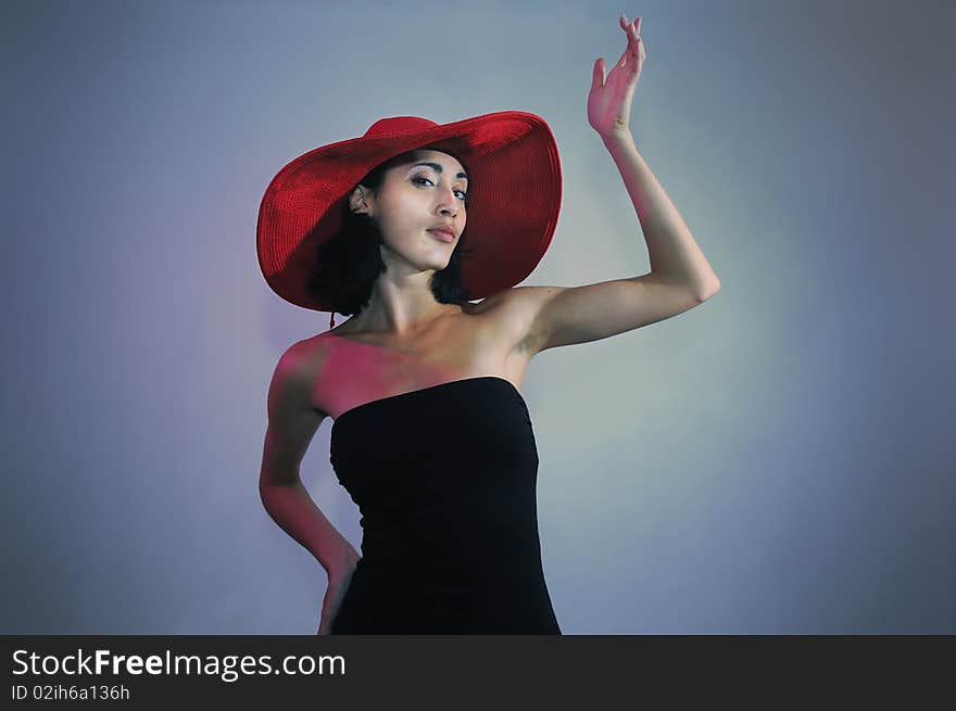 Portrait of young elegant woman wearing black dress and hat. Portrait of young elegant woman wearing black dress and hat