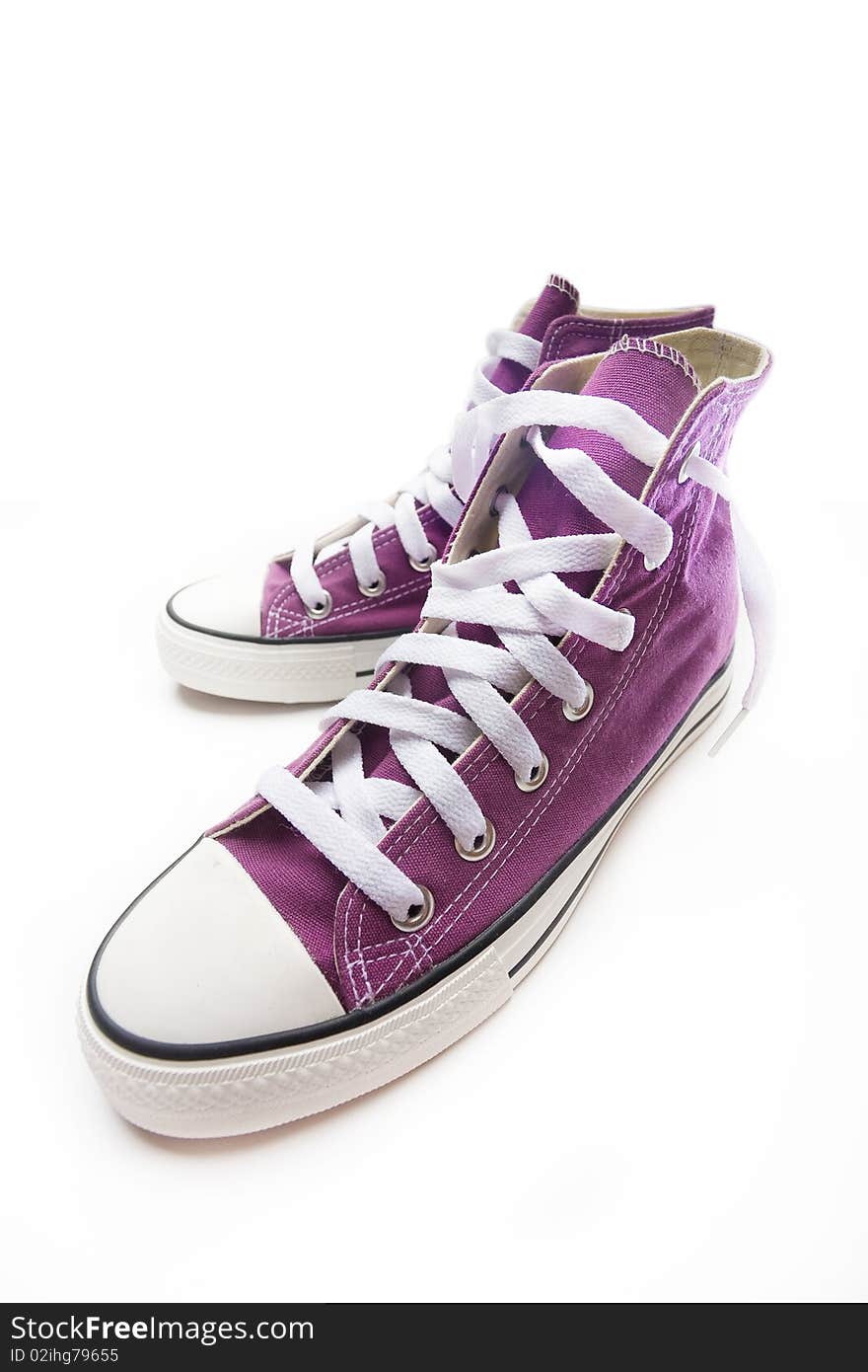 Brand new purple sneakers on white background