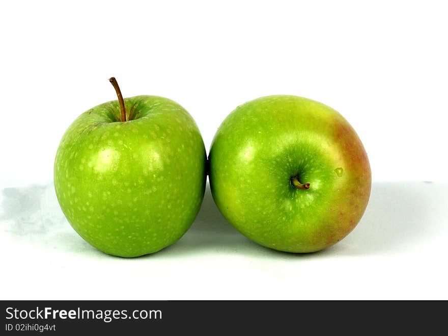 Green apples on white background.