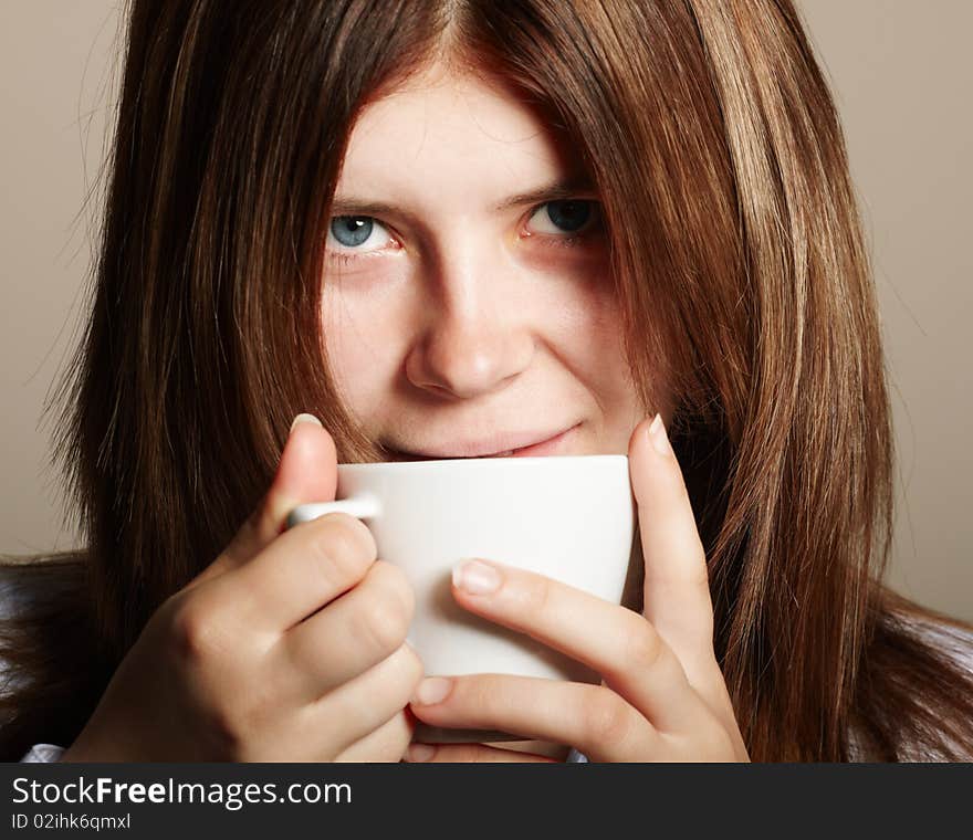 Girl with coffee. studio shot