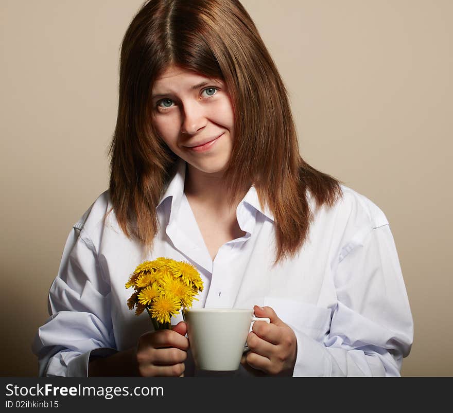 Girl with coffee. studio shot