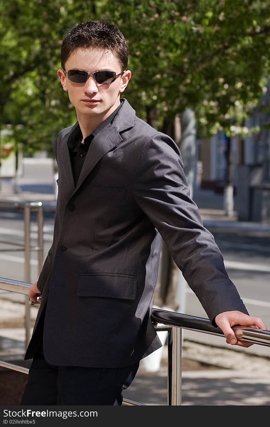 Young man in jacket and sunglasses