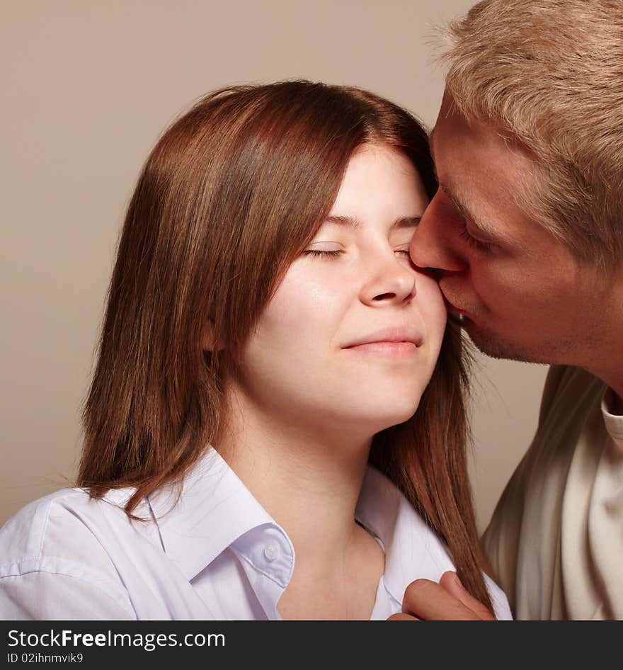 Couple: young man kissing girl