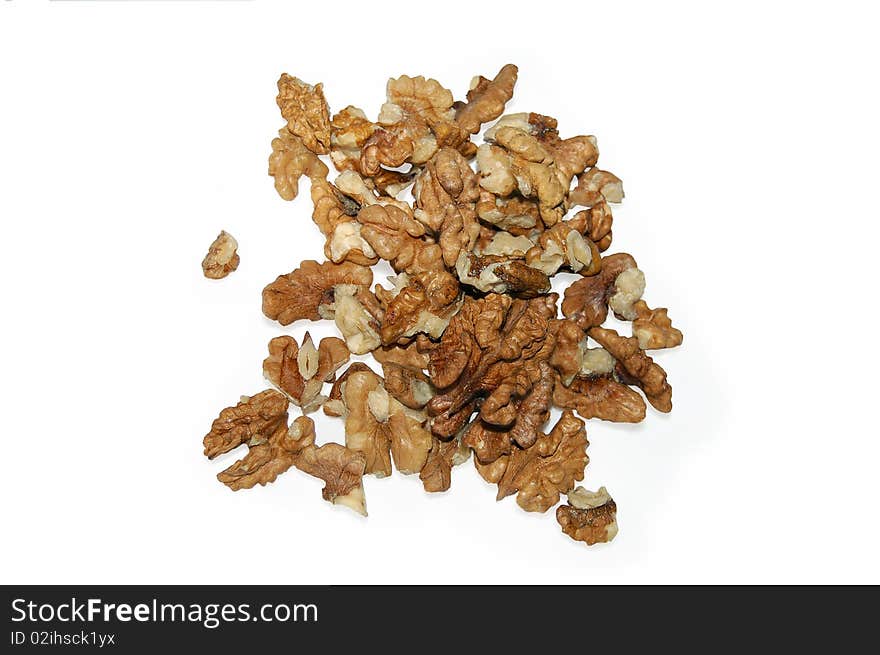 A handful of walnuts with a light shade on white background