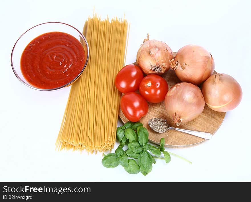 Ingredients for spaghetti bolognese or napoli on white background. Ingredients for spaghetti bolognese or napoli on white background