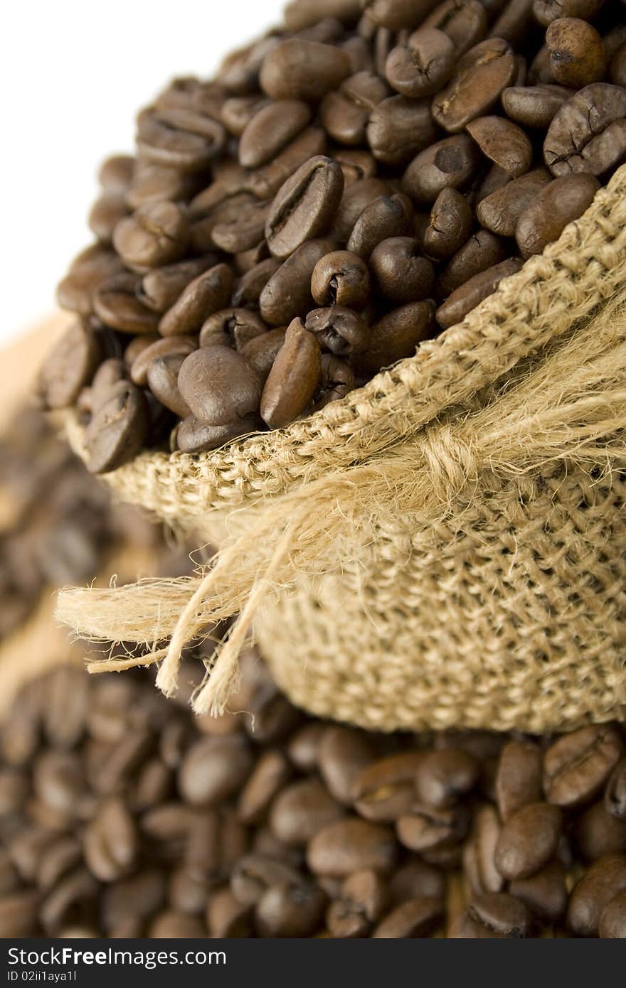 Coffee beans are in the bag and scattered on the table