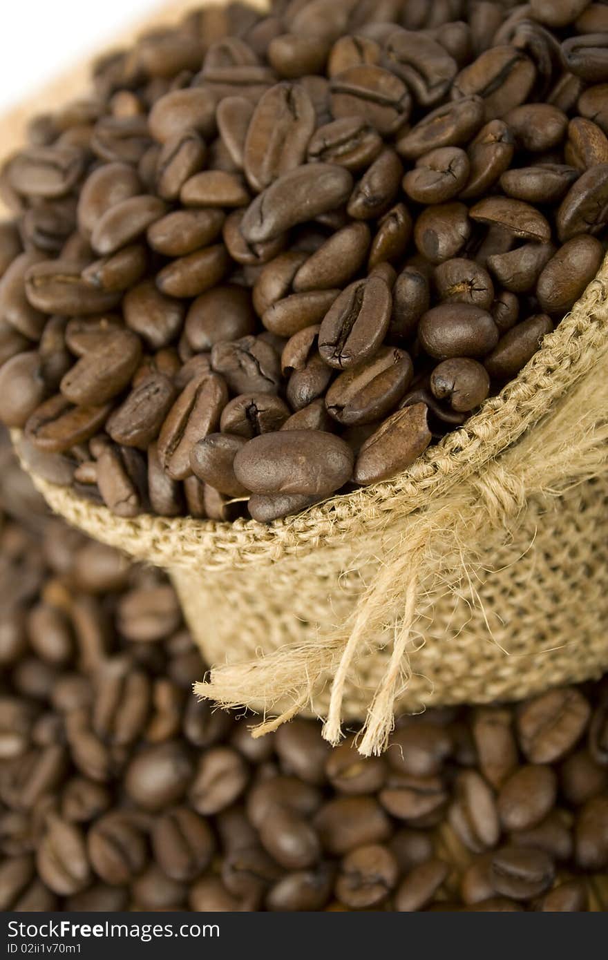 Coffee beans are in the bag and scattered on the table