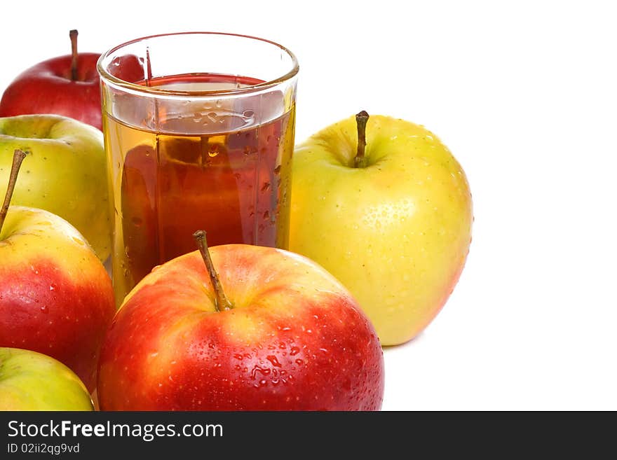 Several fruits and glass full of juice