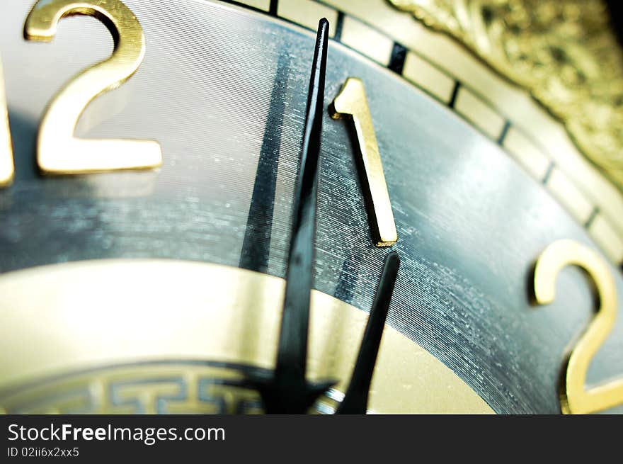 Close view of the clock hands of an antique clock